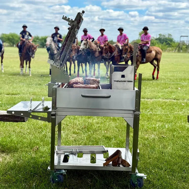Tagwood BBQ33SS Argentine clamp grill cooking meat outdoors at polo field event