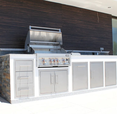 Sunstone 30" vented stainless double access doors installed in outdoor kitchen island below built-in gas grill.
