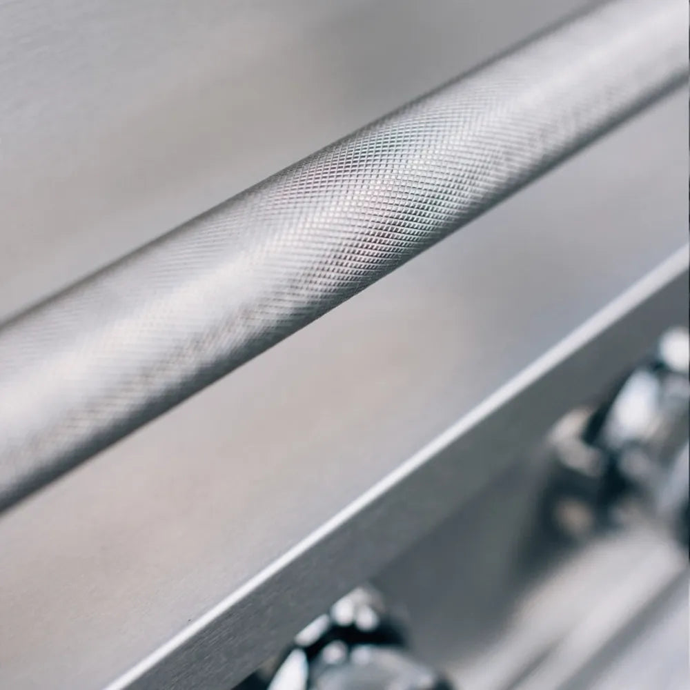 Close-up of a True Flame grill knurled stainless steel hood handle with textured grip.