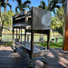Tagwood BBQ18SS stainless steel charcoal grill rear side view on wheeled cart