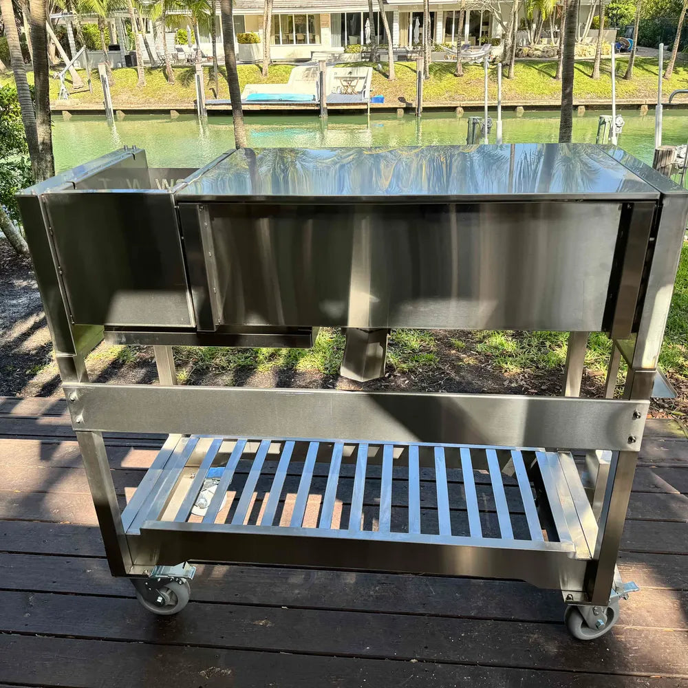 Tagwood BBQ18SS stainless steel grill rear view with storage shelf and caster wheels