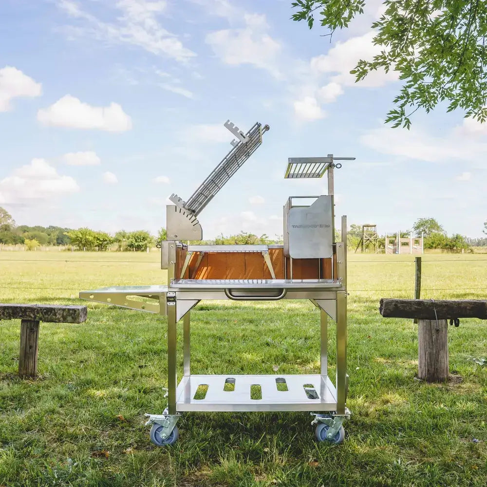 Tagwood BBQ33SS Argentine clamp grill front view with adjustable cooking grate and charcoal basket