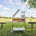 Tagwood BBQ33SS Argentine clamp grill front view with adjustable cooking grate and charcoal basket