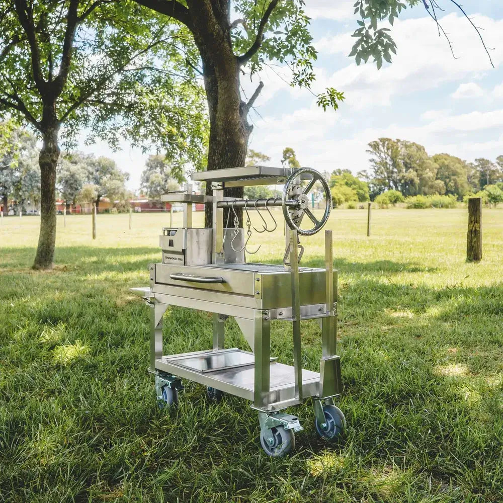 Tagwood BBQ03SS Mini Santa Maria grill rear angle view with crank wheel and storage shelf