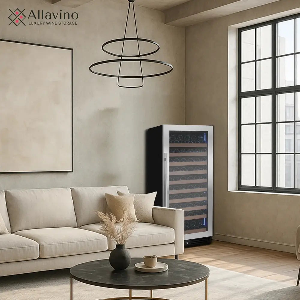 Freestanding Allavino VSW11955S-1SL 119-bottle wine refrigerator styled in a modern living room next to a beige sofa and contemporary minimalist decor.