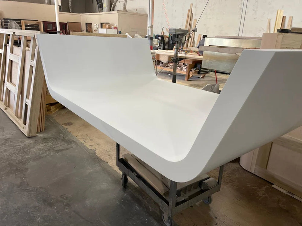 Angled view of White Billiards Sofia curved billiard table base during production