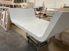 Angled view of White Billiards Sofia curved billiard table base during production