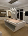 White Billiards Sofia slate pool table with white base and neutral felt under pendant lights