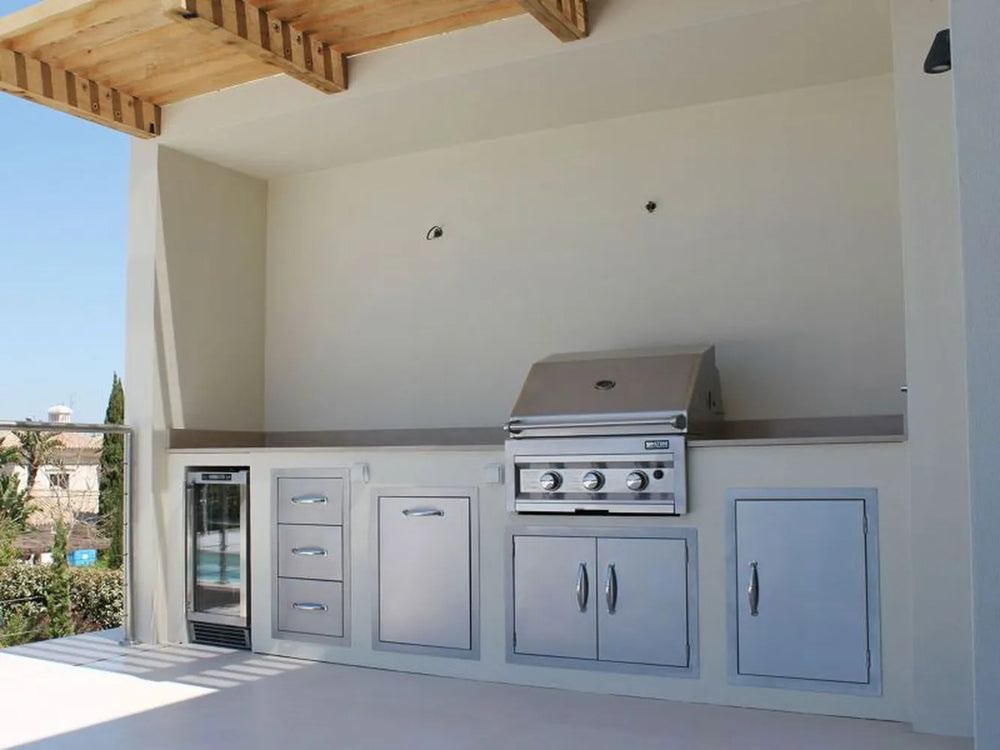 Outdoor kitchen run featuring Sunstone stainless components including the A-DD30 double access door under the grill – clean, built-in look for BBQ islands.