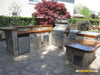 Sunstone A-DV1420 vented access door installed in a stone outdoor kitchen island near grill and sink—stainless door provides clean utility access and ventilation.