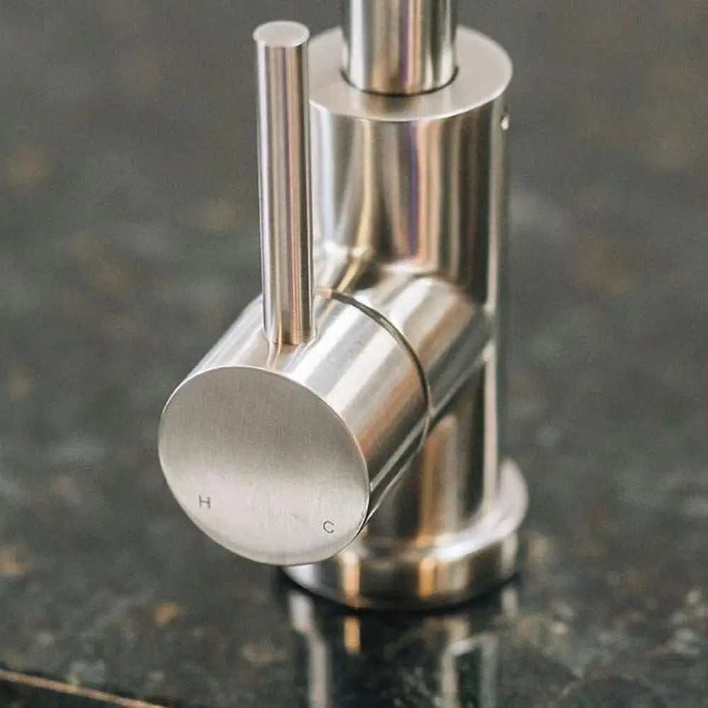 Detail of Summerset outdoor sink faucet lever handle showing the hot (H) and cold (C) indicators.