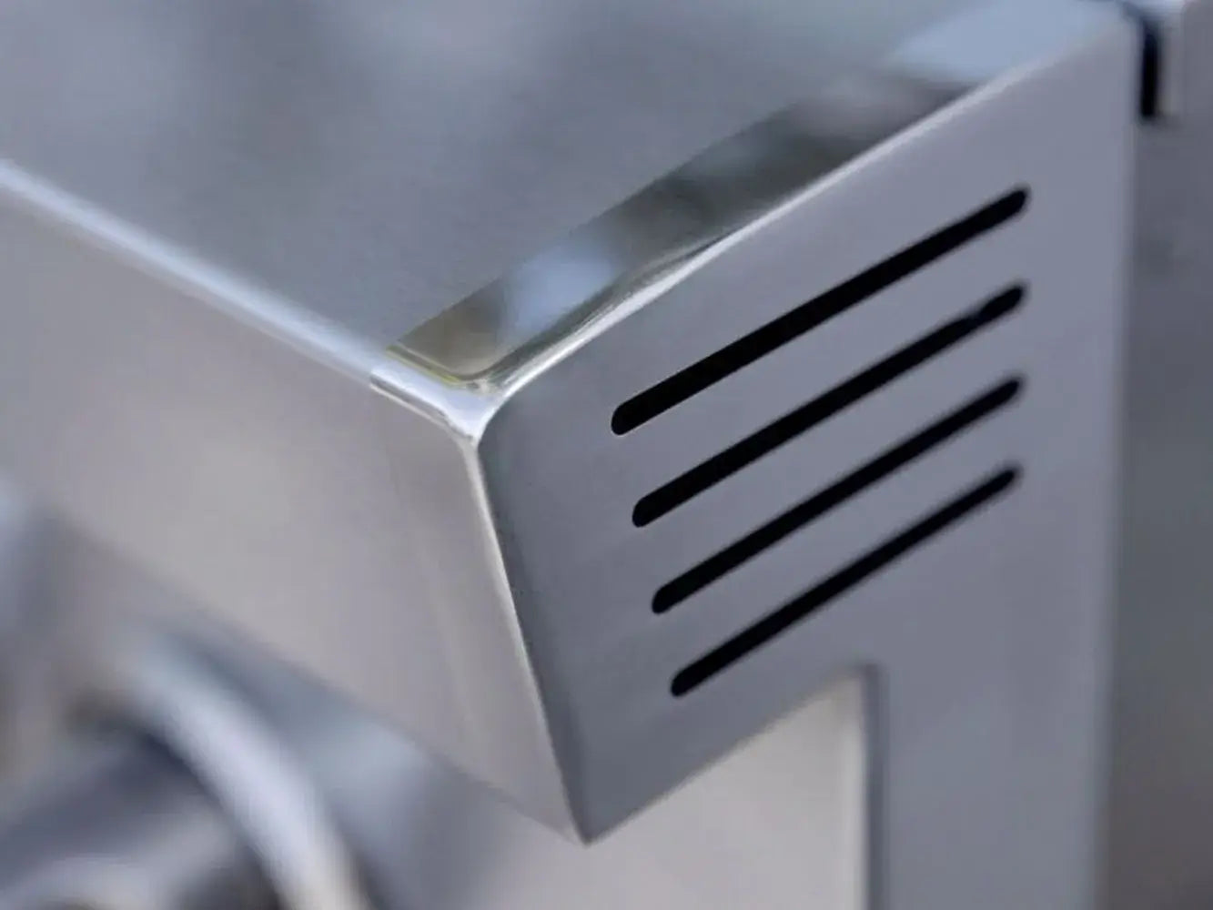 Polished stainless steel finish and ventilation of the American Made Grills ATSSB2 outdoor side cooktop