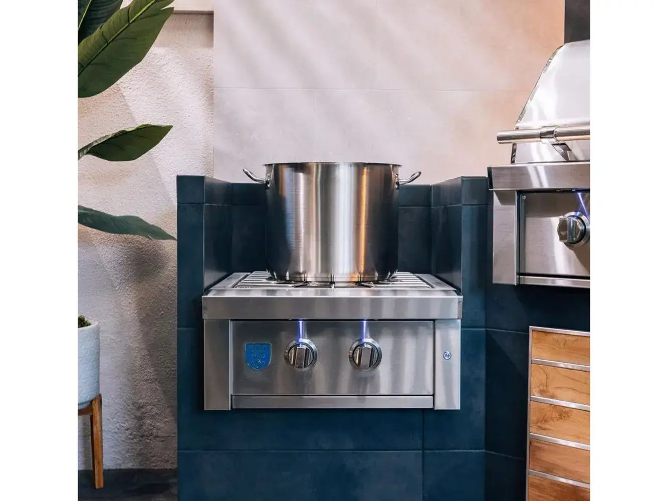 AMG Estate ESTPB2 Power Burner built into dark tiled outdoor kitchen cooking a large stockpot