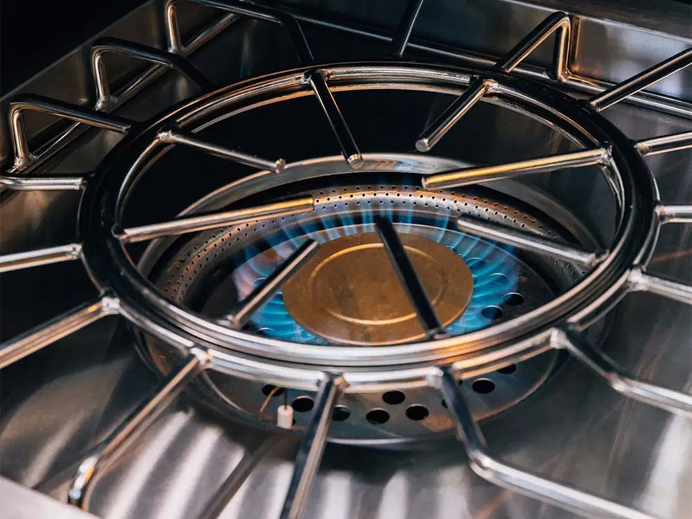 Close-up of high-performance natural gas blue flame on a powerful outdoor kitchen burner