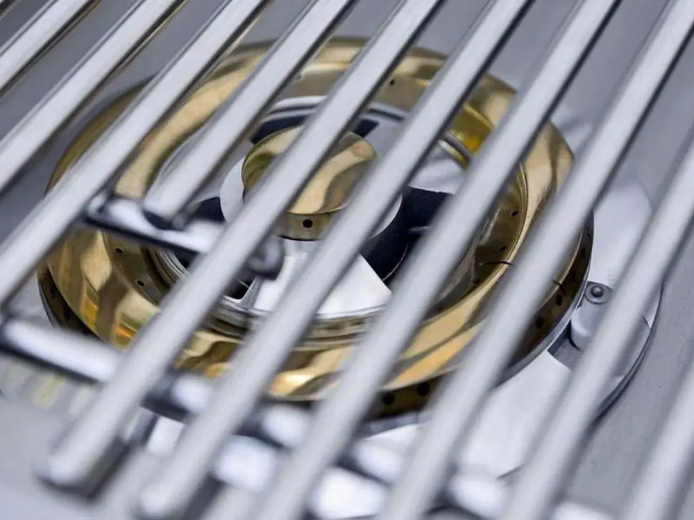 Close-up of high-performance brass burner and heavy-duty stainless steel grates on ATSSB2 side burner