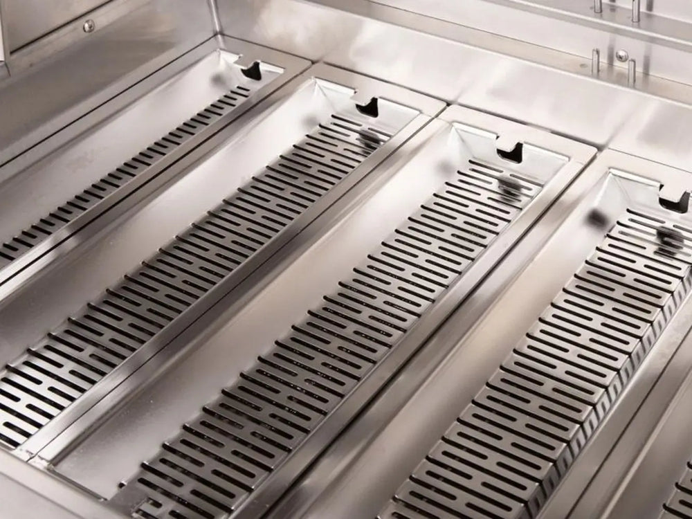 Stainless steel flame tamers inside professional gas grill