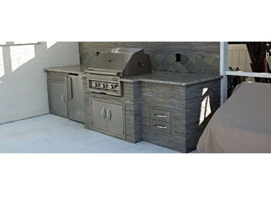 Shows the double-drawer unit installed in an outdoor kitchen island (right side of the grill area).