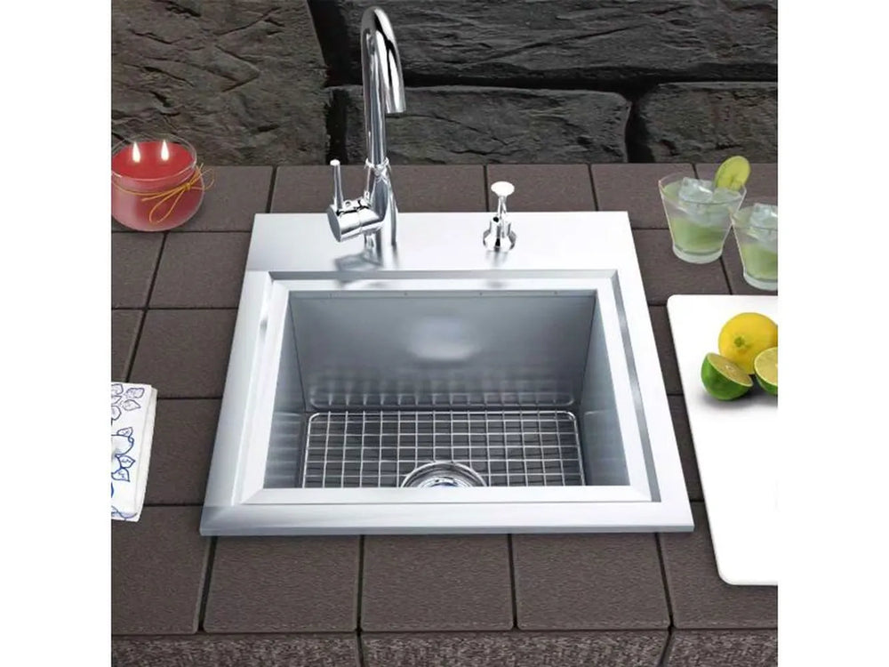 Sunstone B-PS21 sink installed in outdoor countertop with faucet, bottom grid and cutting board cover, ideal for patio kitchen prep.