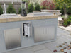 Sunstone BA-TH17 stainless swivel paper towel holder installed in outdoor kitchen island near sink and prep area, paper towels accessible.