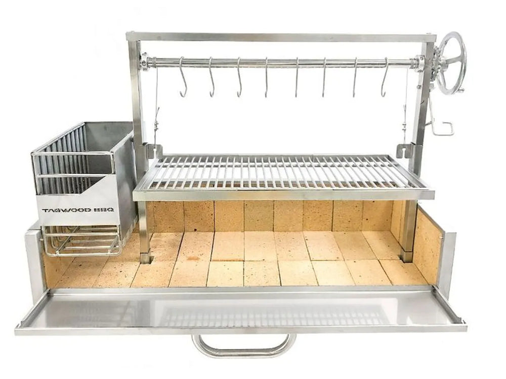 Tagwood BBQ05SS built-in Santa Maria grill installed in masonry grill island with refractory bricks front view