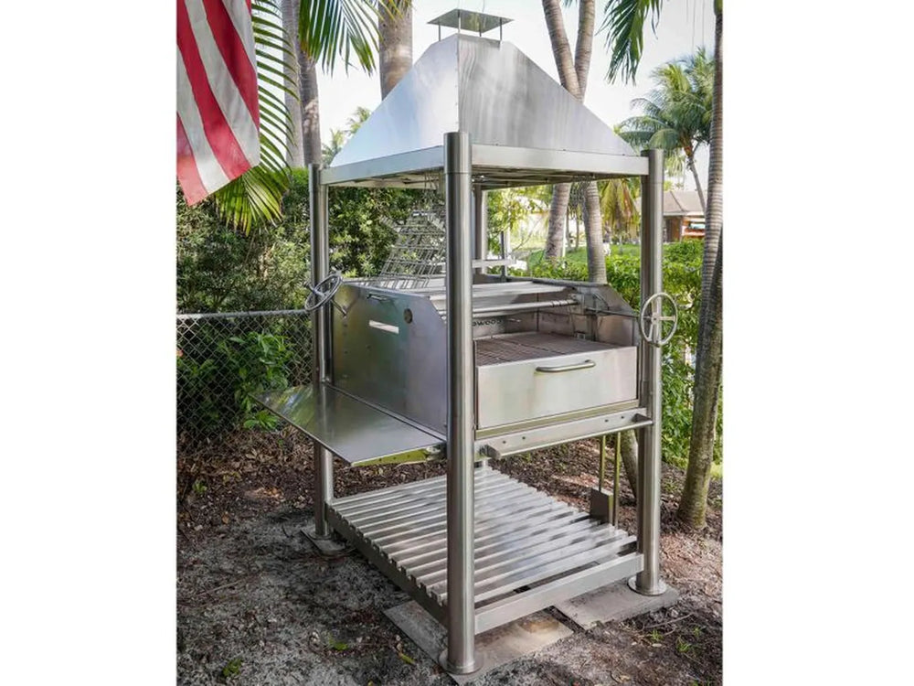 Tagwood BBQ BBQ12SS Santa Maria grill outdoor setup under palm trees with American flag