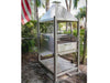 Tagwood BBQ BBQ12SS Santa Maria grill outdoor setup under palm trees with American flag