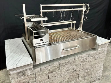 Tagwood BBQ25SS XL built-in Santa Maria grill installed in outdoor masonry island with stainless grill system
