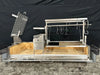 Tagwood BBQ28SS built-in Santa Maria grill installed in outdoor masonry island with adjustable crank grate and brasero firebox