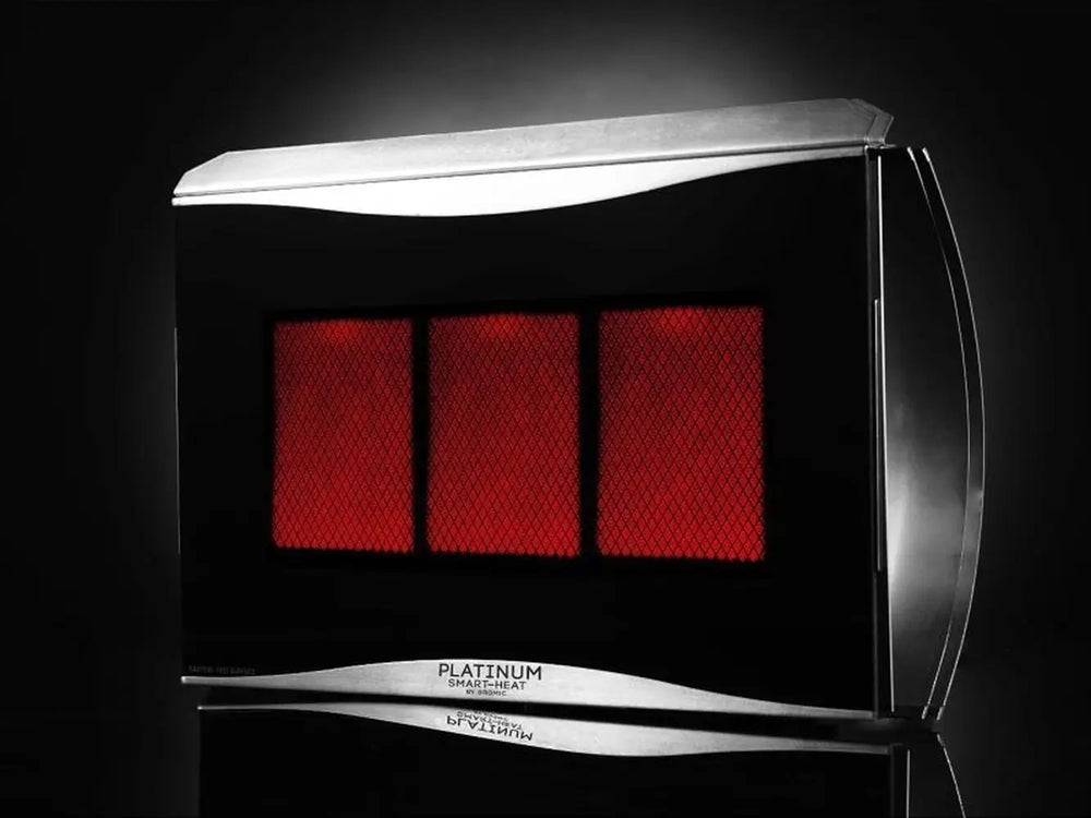 A dramatic, low-light studio shot of the Bromic Platinum 300 Gas Radiant Heater, with a reflective surface creating a mirror image of the heater.