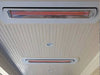 Flush-mounted Bromic Tungsten 6000W Heaters installed in a wood-paneled ceiling, delivering discreet and efficient heating coverage for covered outdoor areas.