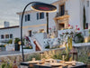 Bromic Eclipse black portable electric heater with curved stand on a stylish outdoor patio in a luxury residence.