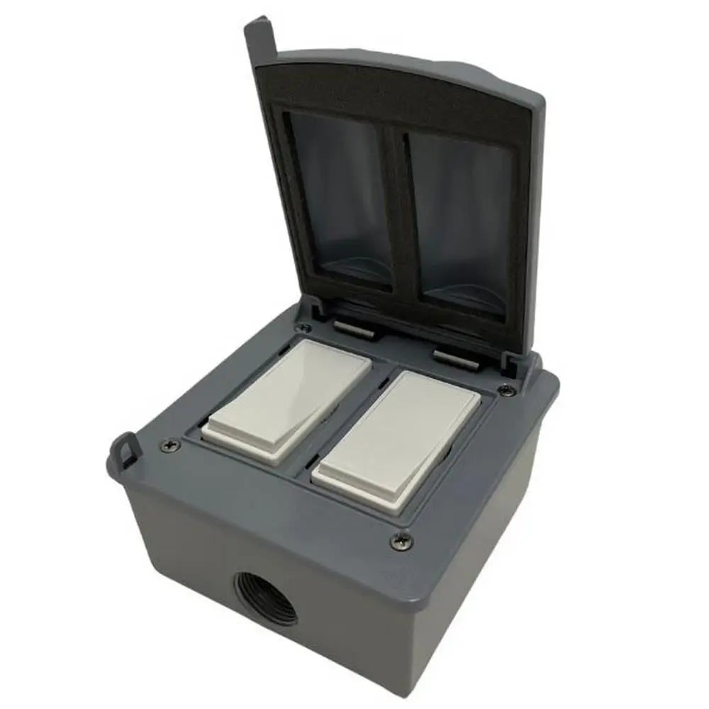 Bromic Affinity Double Pole white manual switches in open gray weatherproof outdoor box.