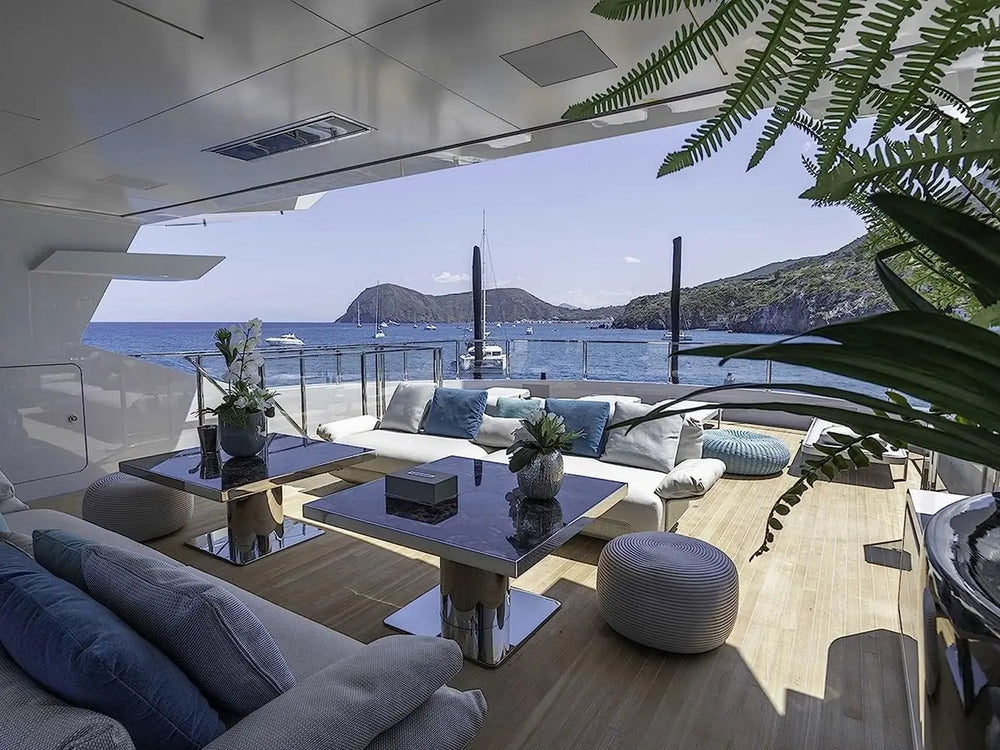 Bromic Platinum 4500W Marine Infrared Heater installed on a luxury yacht ceiling, heating an outdoor seating area with ocean views and modern furnishings.