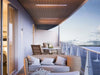 Bromic Platinum 4500W Marine Infrared Heaters installed on a modern curved balcony ceiling, providing seamless comfort with a view of the ocean horizon.