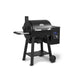 Angled product shot of the Broil King Regal Pellet 400 WiFi pellet grill with closed lid, highlighting the matte black finish, side handle shelf, pellet hopper control box, and compact freestanding frame.