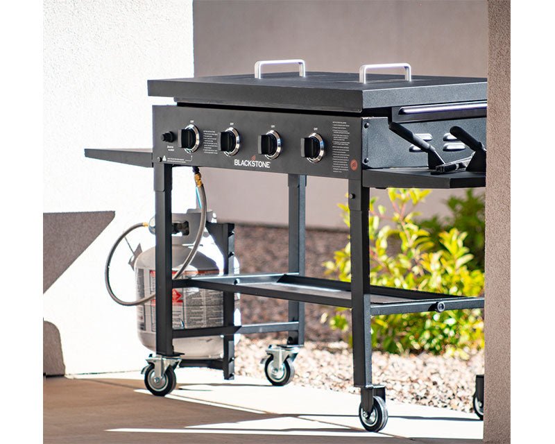 Blackstone 36-inch griddle with hard cover in outdoor patio setting – protects cooktop from debris and weather