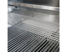 Cooking surface of the Broilmaster 25 inch grill showing warming rack and primary stainless steel cooking grates
