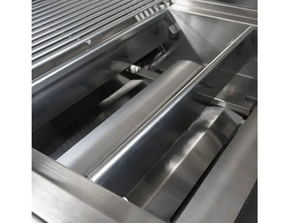 Grill firebox interior showing stainless steel burner covers and internal components.