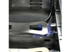 Close-up of the main cast stainless steel burner (H-style) lit with blue gas flames.