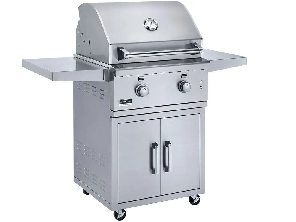 Broilmaster 26 inch stainless steel gas grill on cart with side shelves and storage cabinet.