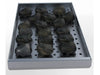 Sunstone charcoal smoking tray filled with charcoal briquettes on perforated panel, angled view on white background.