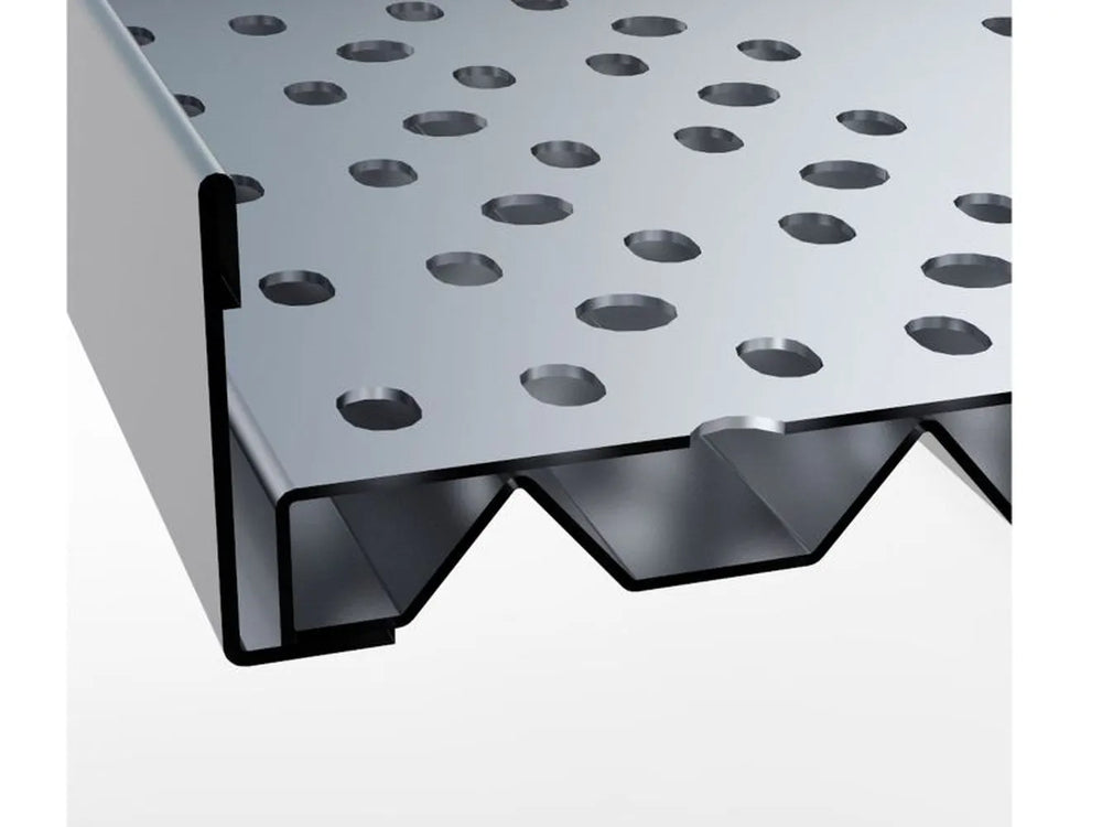 Close-up of Sunstone perforated charcoal tray edge showing layered metal design and vented underside profile.