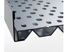 Close-up of Sunstone perforated charcoal tray edge showing layered metal design and vented underside profile.