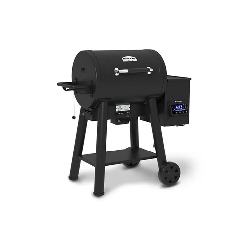 Angled front-left product shot of the Broil King Crown Pellet 400 WiFi pellet smoker, showing the closed barrel lid, chrome handle, side shelf, pellet hopper with digital screen, lower support shelf, and rolling wheel design.