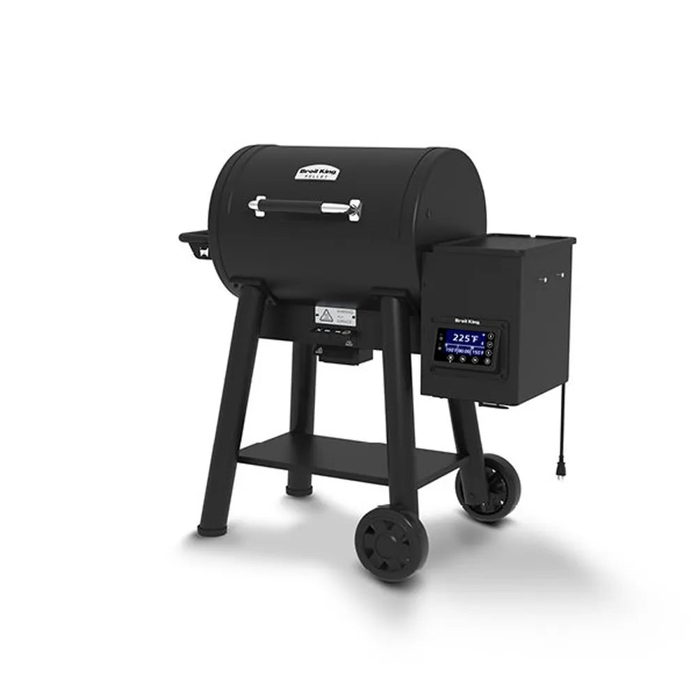 Rear angled view of the Broil King Crown Pellet 400 WiFi pellet smoker, emphasizing the cylindrical black cooking chamber, side pellet hopper with controller and hanging power cord, lower storage shelf, and two-wheel portable base.