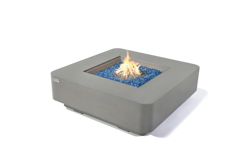 Elementi Plus Lucerne light gray square fire table with blue fire glass and active flame.