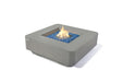 Elementi Plus Lucerne light gray square fire table with blue fire glass and active flame.