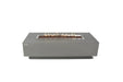 Lit 59.8" Elementi Granville OFG121LG Fire Table showcasing linear stainless steel burner and grey finish.