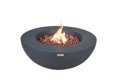 Elementi Lunar Bowl fire pit in gray concrete with active orange flames and lava rocks on a white background.