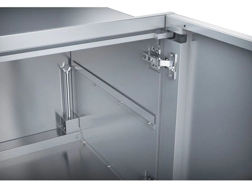 Close-up of Sunstone DE-DD42 stainless hinge hardware and interior shelf support inside raised double door cabinet.